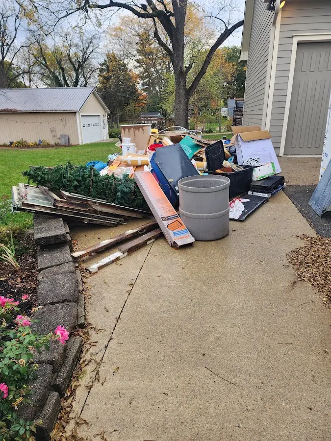 Dumpster being loaded with debris for Roofing Dumpster Rental in Palatine